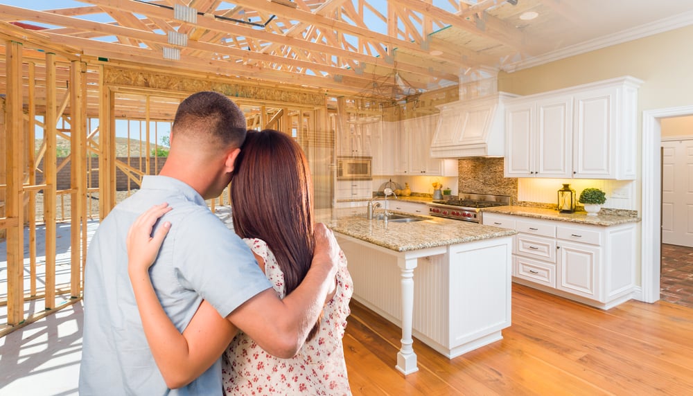young couple looking at a rhode island home building 