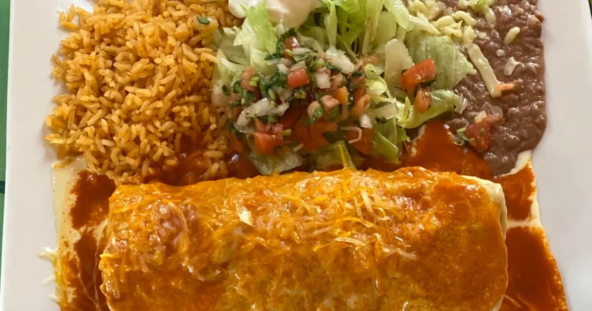 A burrito with rice, beans, and salsa at El Charro